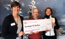 The American Birkebeiner Ski Foundation receives a $12,450 JEM Grant from the Wisconsin Department of Tourism. From left: Regional Tourism Specialist Julie Fox with Ben Popp and Nancy Knutson of the American Birkebeiner Ski Foundation.